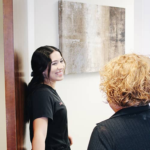 Oral Surgeon Assistant smiling at patient