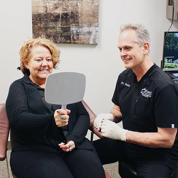 Dr. Austin providing instructions to a patient after a tooth is removed.