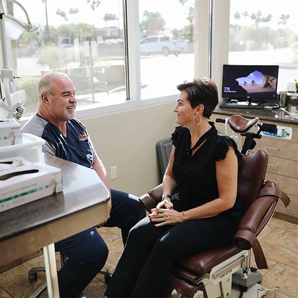 Dr. Boyse talking to a patient about safety procedures